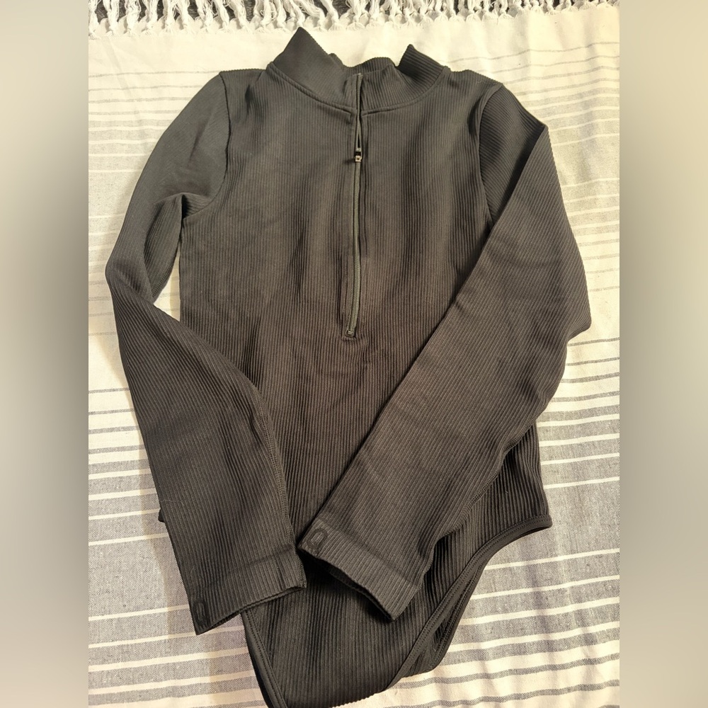 OQQ ribbed long sleeve bodysuit.